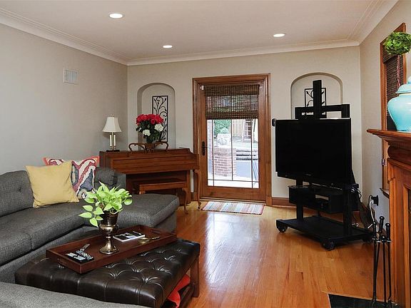 The well sized Living Room opens to a patio.