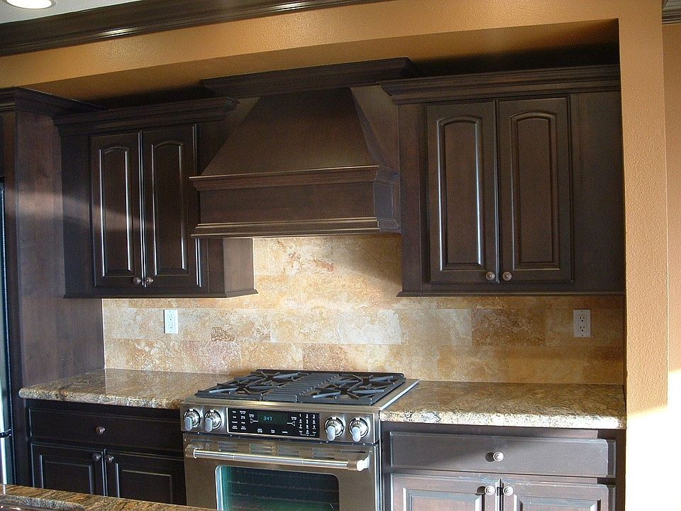 Kitchen with Alder wood Cabinetry with a truffle finish