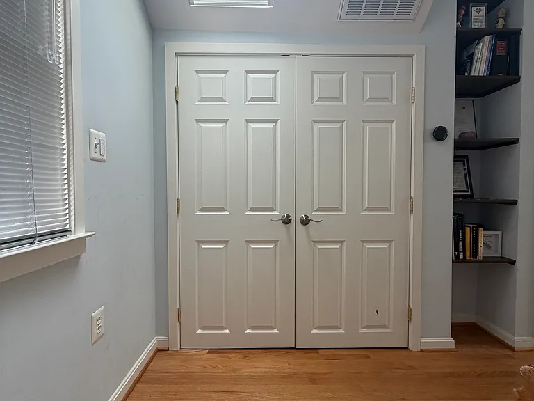 The closet at the top of the stairs where the washer and dryer live