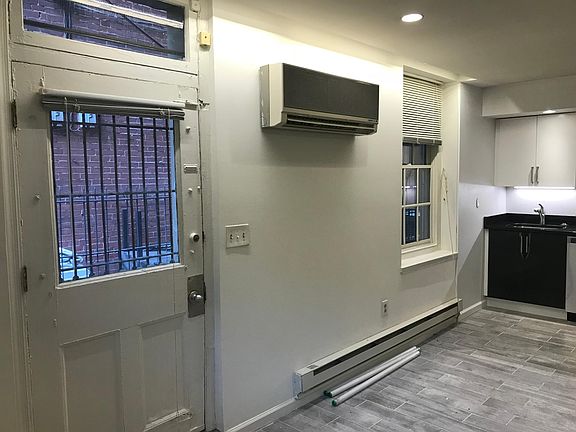 Main living/kitchen area w/ door to yard