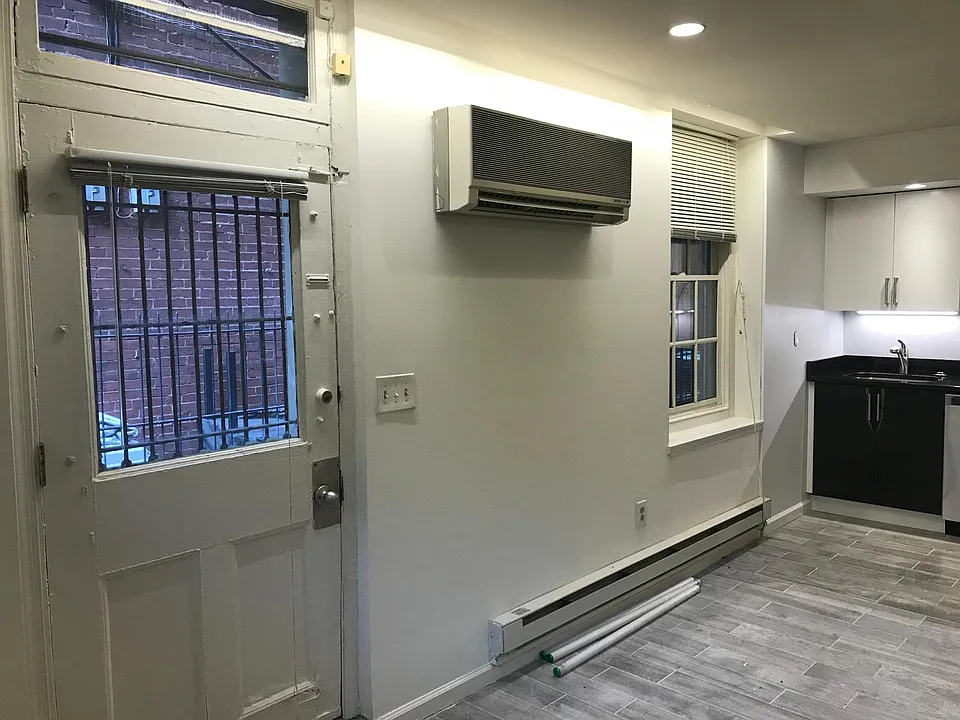 Main living/kitchen area w/ door to yard