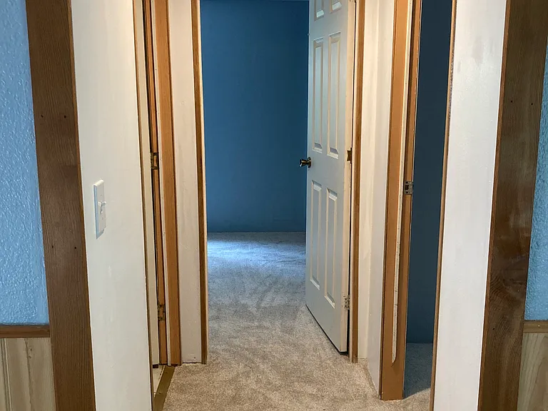 Hallway to bathroom and bedrooms