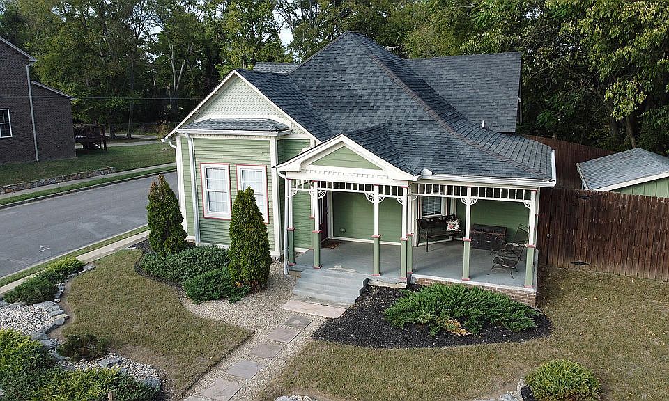 Front view of house and porch.