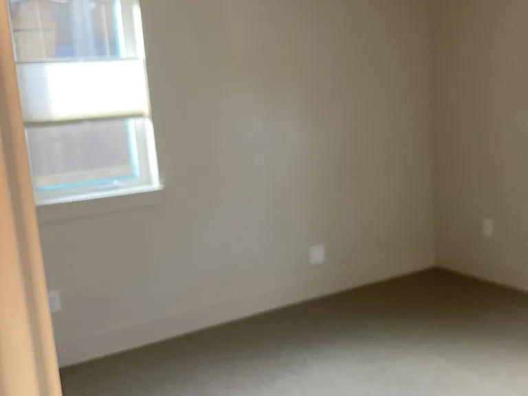 Bedroom with lots of light, up/down shades.