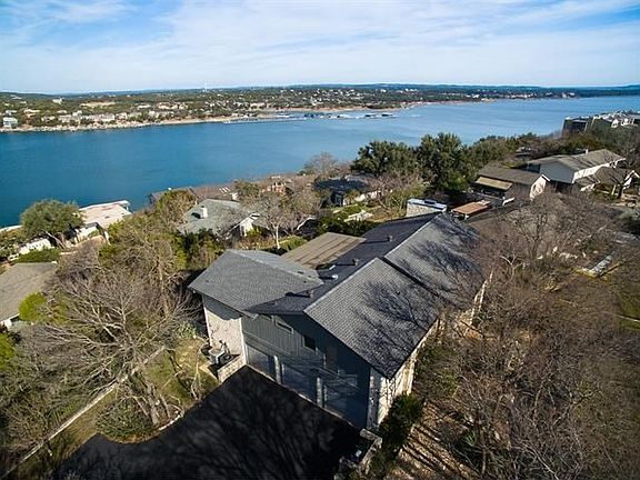Aerial view of house.  Notice three car garage and ample parking in addition to circular drive in front.