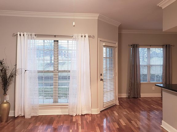 View of lake from living room and dining room windows. Patio out side overlooking lake.