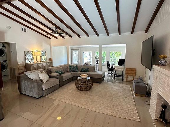 Vaulted ceilings with original wood beams.