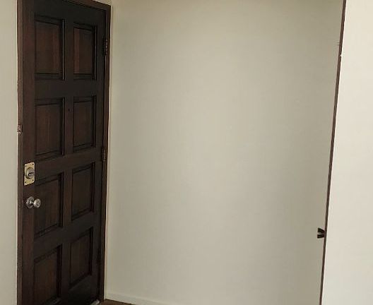 Tiled entry with coat closet.