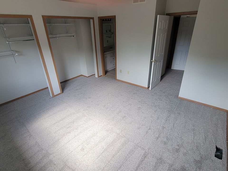 Master bedroom with master bath, his/her sinks, shower and toilet.