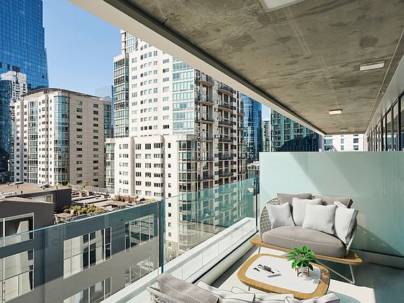 Enjoy a night in on your private balcony with downtown views!