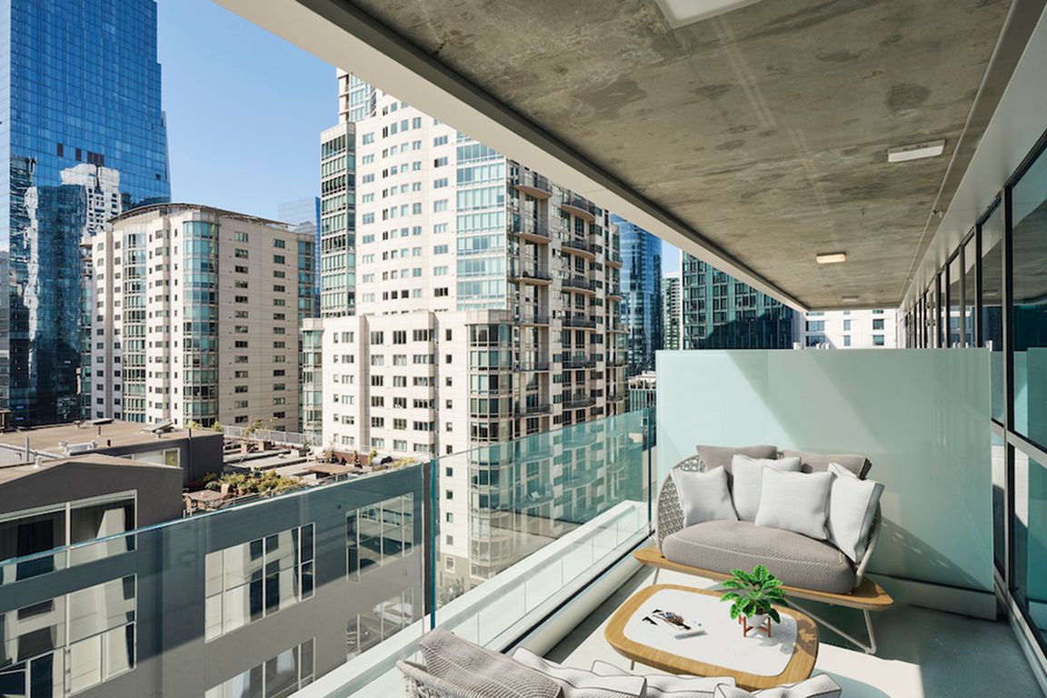Enjoy a night in on your private balcony with downtown views!