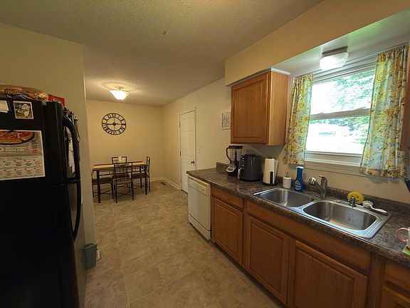 Kitchen and Dining with door to the backyard.