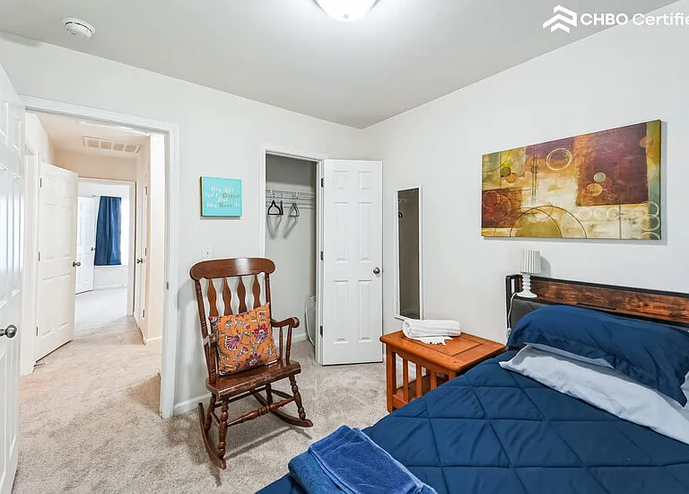 Bedroom is across from the bathroom.