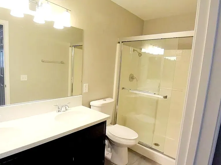 Master Bathroom with shower, and His-and-Hers vanities.