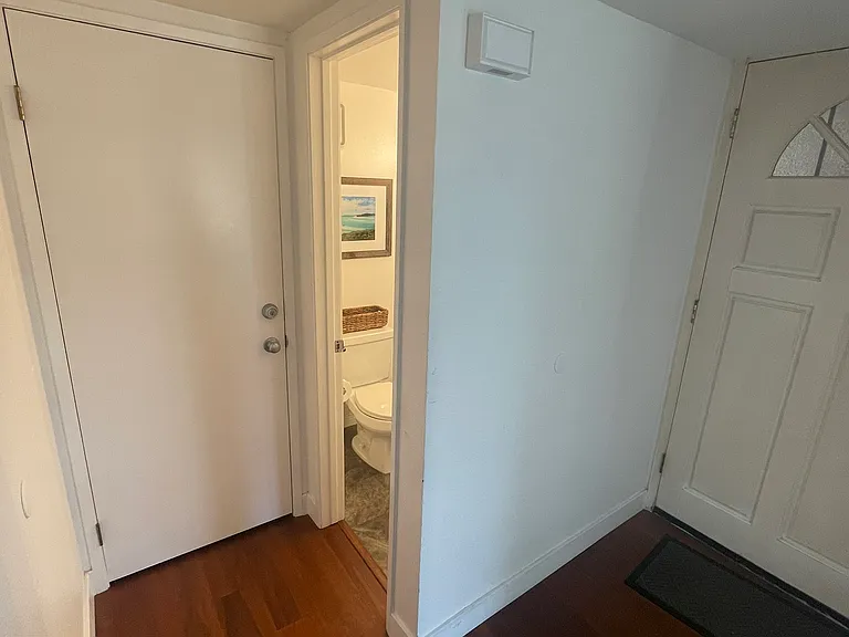 Foyer, coat closet, and guest bathroom