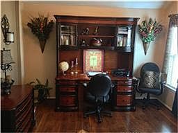 step inside the office overlooking the front entry.