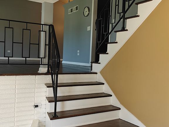 Stairs going up to living/dining / kitchen