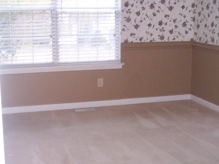 OLDER PICTURE OF DINING ROOM 
UPDATED FLOORING, PAINT, LIGHTING FIXTURES. WALL PAPER HAS BEEN REMOVED