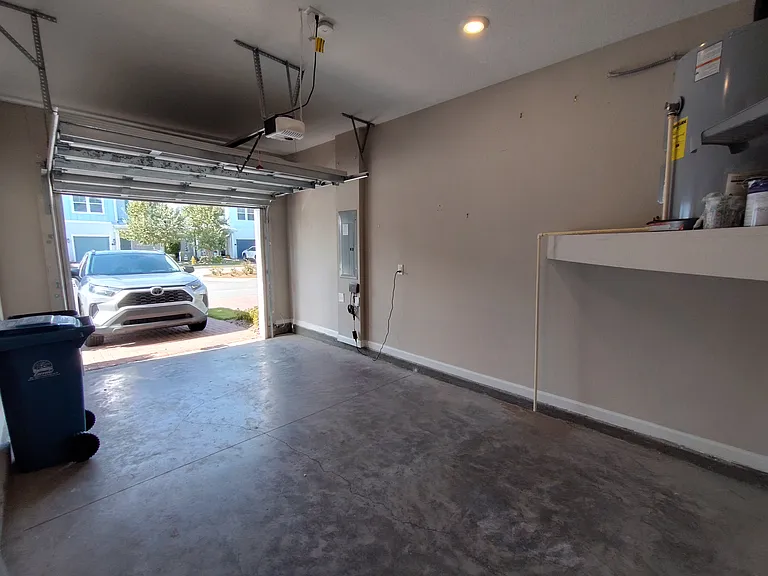 Single garage, guest spaces in median or near postal boxes 1 block away