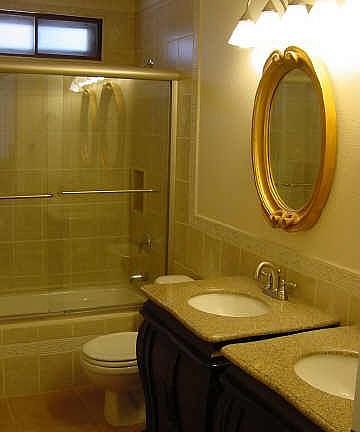 Both bathrooms have granite countertops on designer vanities