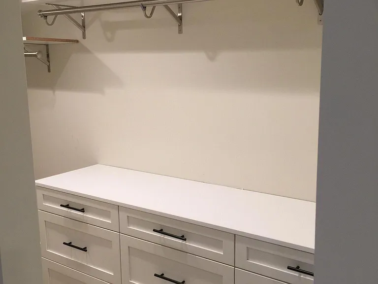 Master Bedroom one of two closets with built-in dressers
