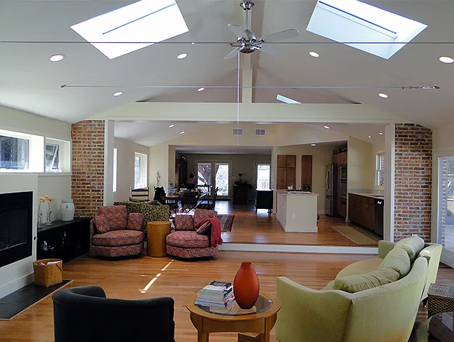 The living space, with skylights, fireplace.