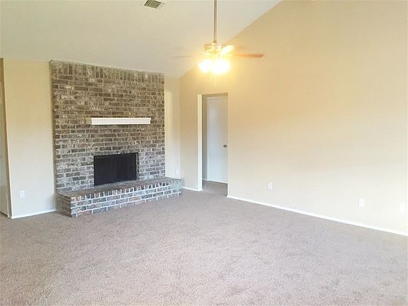 Big living room with wood burning fire place
