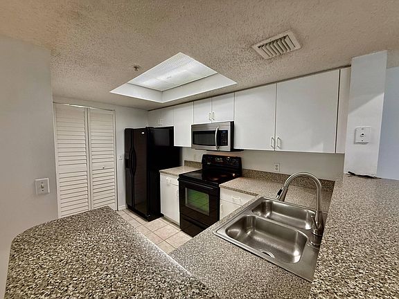 2nd image of 5041 Wiles Rd #9208