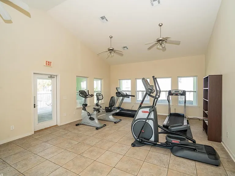 The air-conditioned clubhouse next to the pool features exercise machines for quick workouts, a small meeting space, and easy restroom access.