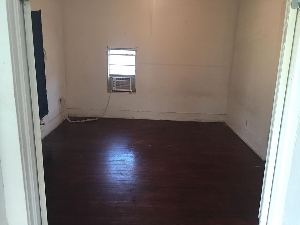 Large bedroom with window a/c unit
