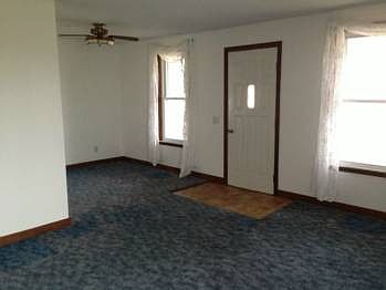 The living room with the ell of to the left that has a closet and could be used for the 4th bedroom.