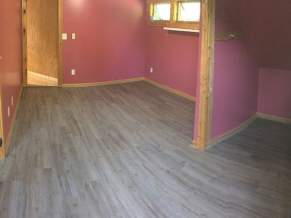 Living Room - Replacement wood grain vinyl flooring.
