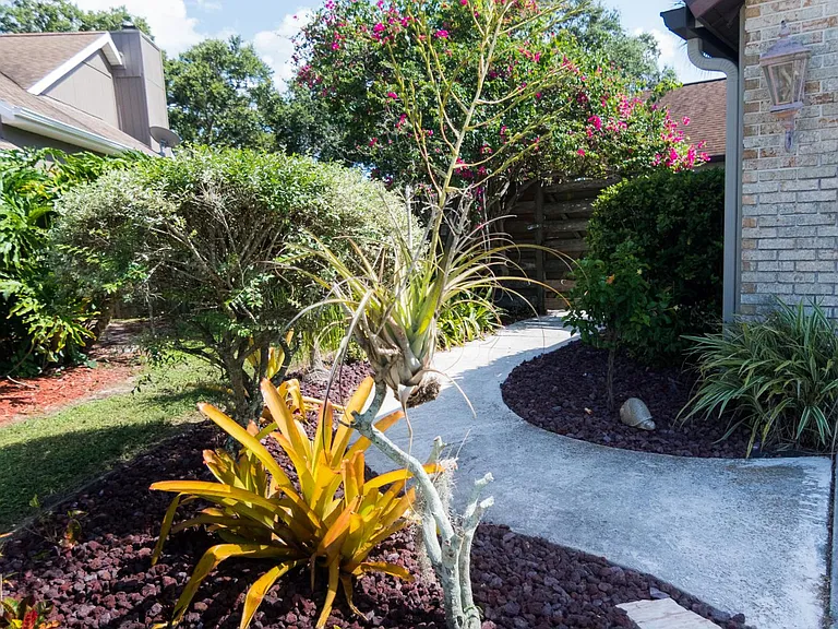 Walkway to the private fenced in courtyard and apartment