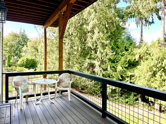 Private deck and entry to downstairs unit