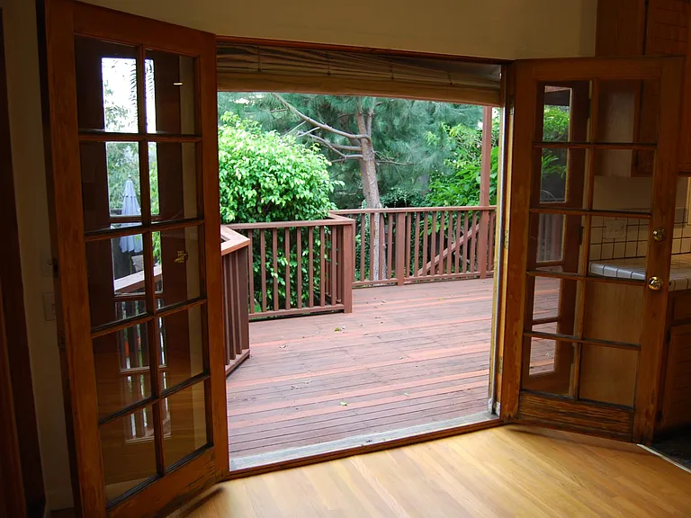French doors lead to large South facing deck and garden