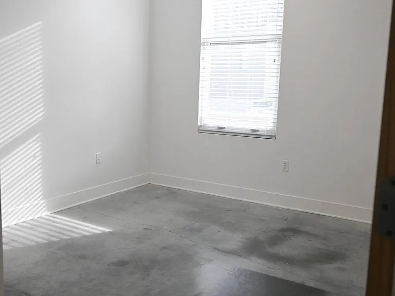 Large window with natural lighting in a bedroom at The Sawyer.