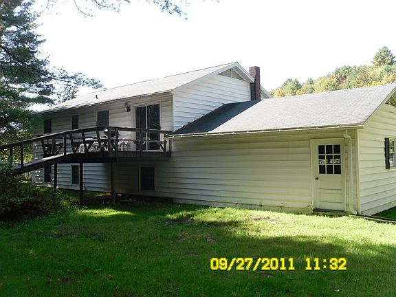 Back of house with Deck
