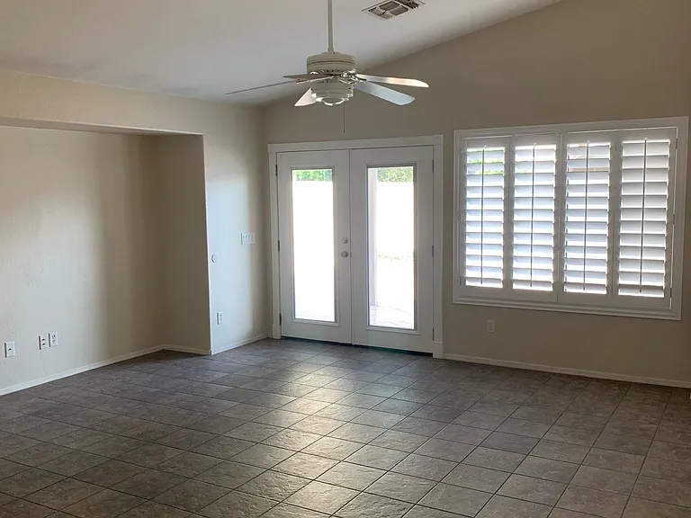 Beautiful window shutters. French doors with integral mini blinds. Entertainment system/TV nook.