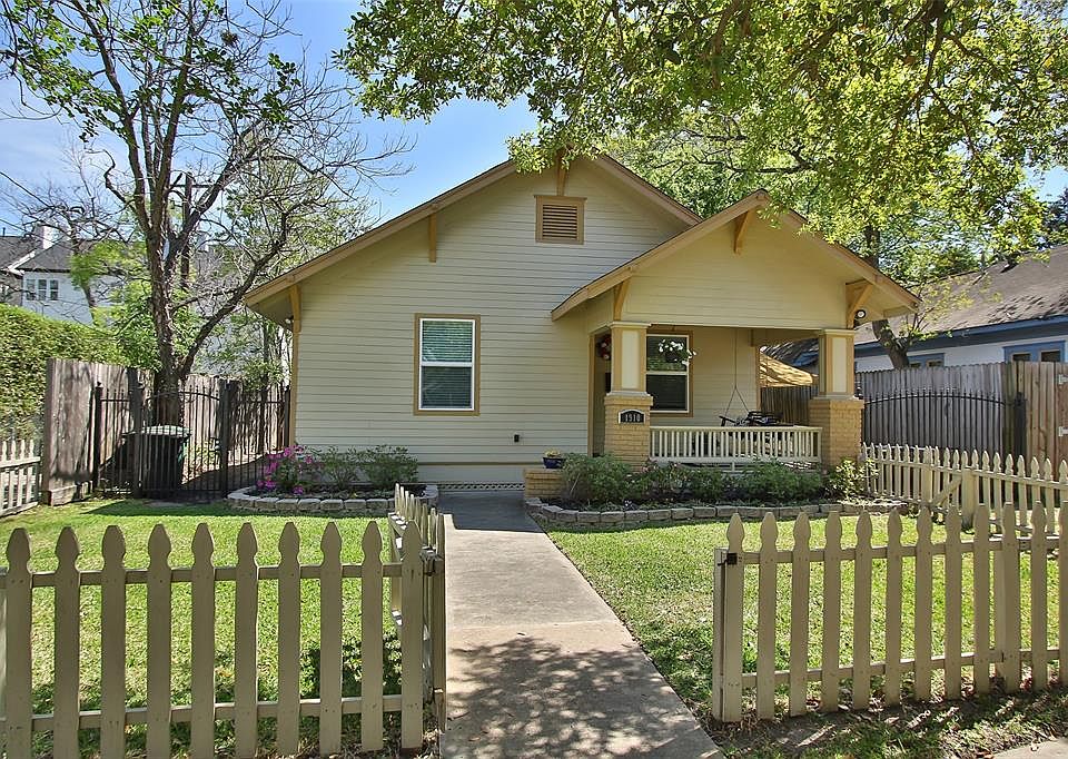 WELCOME HOME to this charming 1920-built bungalow in The Heights that marries historic charm with beautiful interior updates.