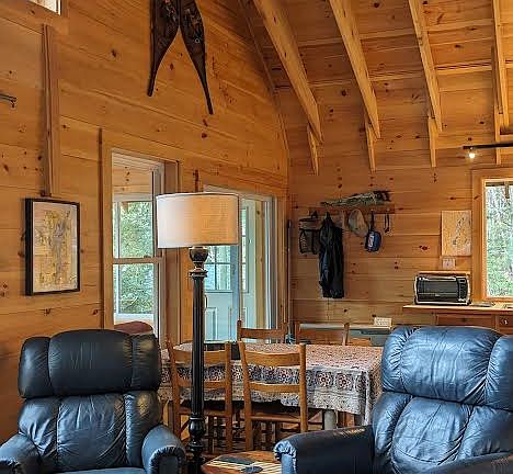 living room recliners, looking toward table and sliding glass door to porch