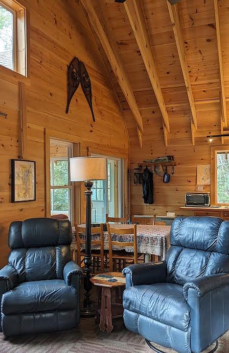 living room recliners, looking toward table and sliding glass door to porch