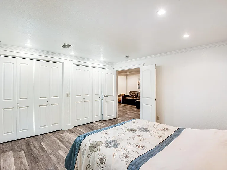 Lower level bedroom with dual closets.