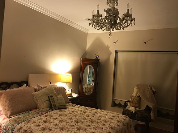 Chandelier in master bedroom