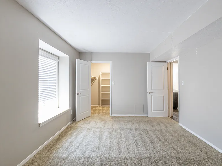 Master Bedroom in the One-Bedroom Apartment with Loft at Woodbridge Bloomington