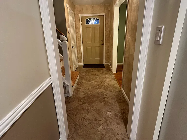 Looking from kitchen entrance back to the front door - bright and inviting.