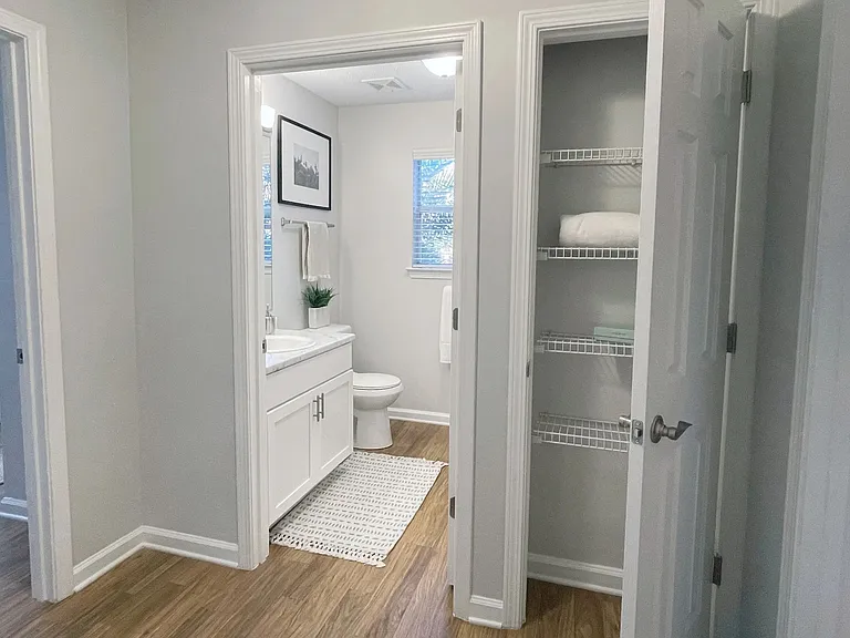 Discover the convenience of thoughtful storage in our apartment homes, such as this linen closet in the hallway, providing a stylish and organized space for your essentials.