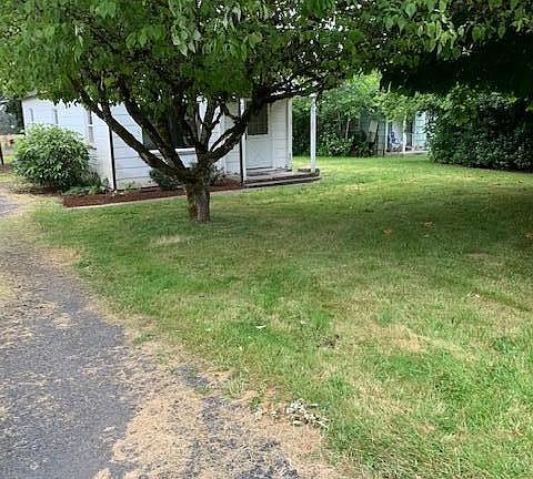 Looking from the drive way to the front of house