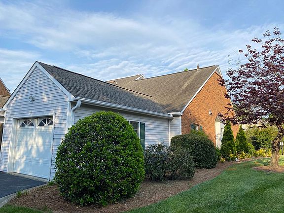 Your own private garage with security light nicely landscaped.