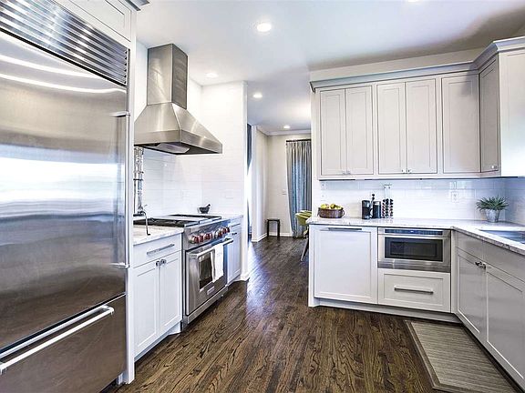 Stainless Steel Appliances and a Wolf Gas Range along with soft close cabinetry