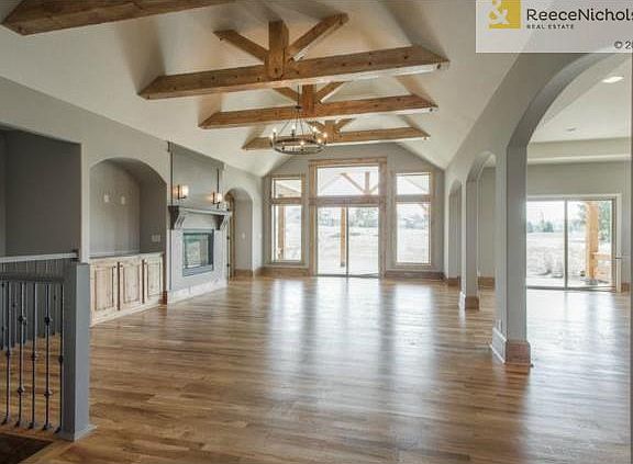 Rustic Beams and Hardwoods in Great Room!